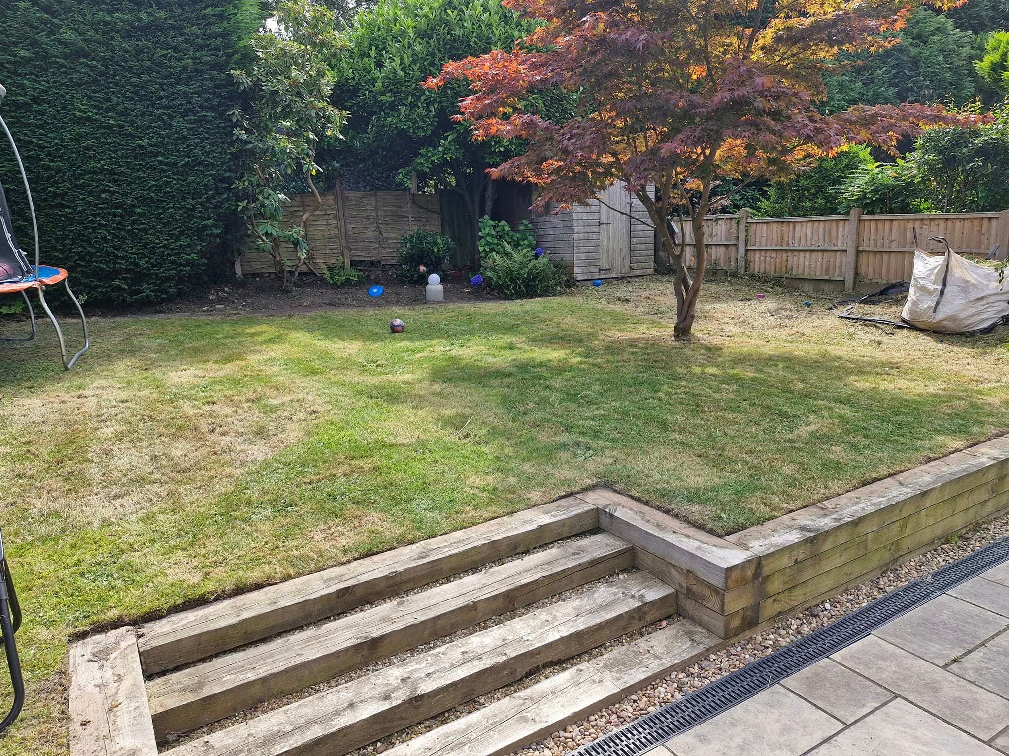 Well maintained lawn and wooden steps image by D.J.W Garden Maintenance